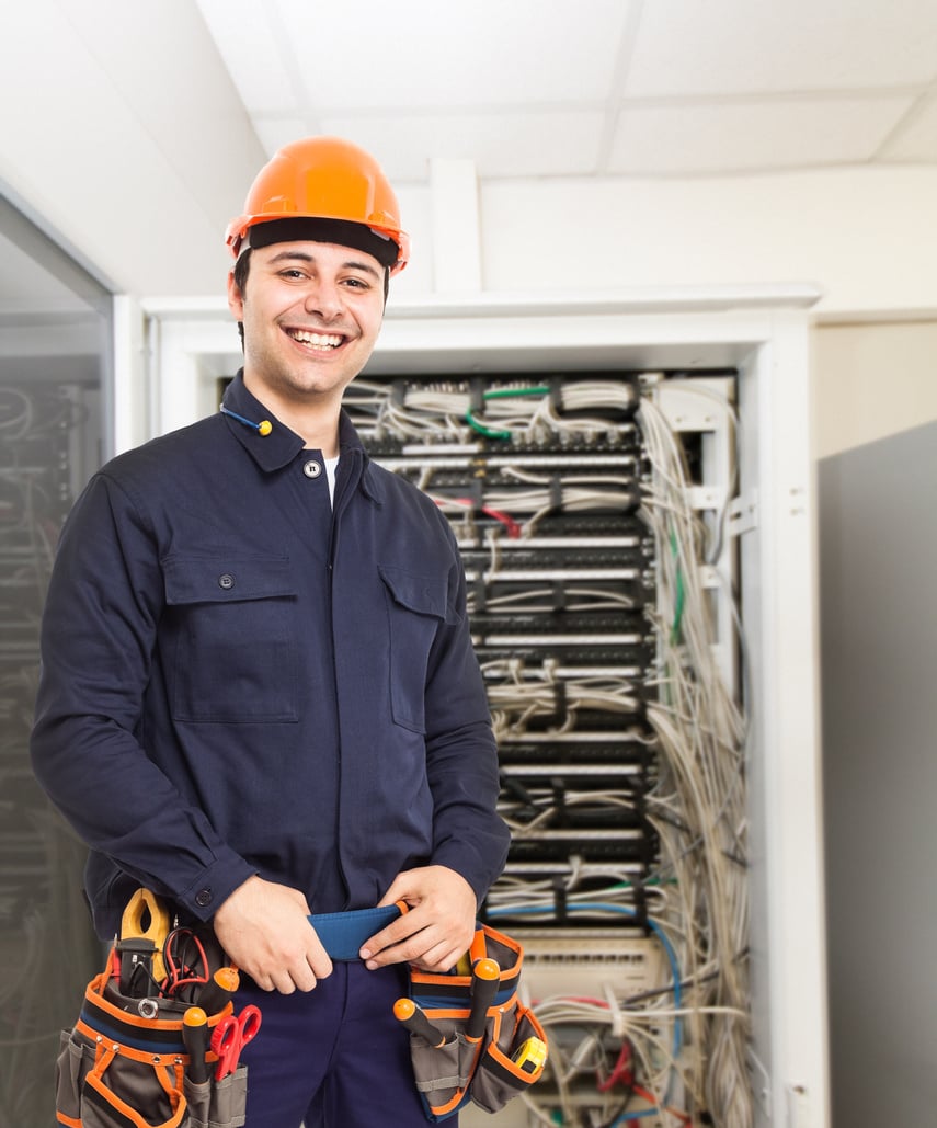 Technician in Front of a Network Rack